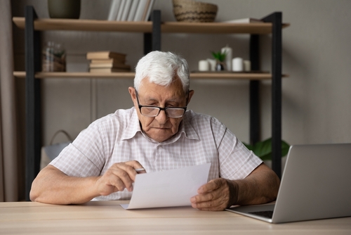 Serious Focused Elderly Man Wear Glasses Holding Paper Read Received Serious Focused Elderly Man Wear Glasses Holding Paper Read Received